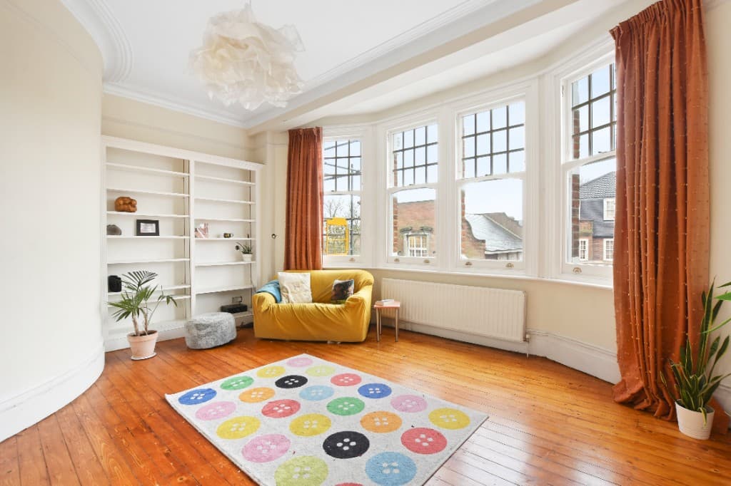 Sparsely furnished reception room before traditional virtual staging