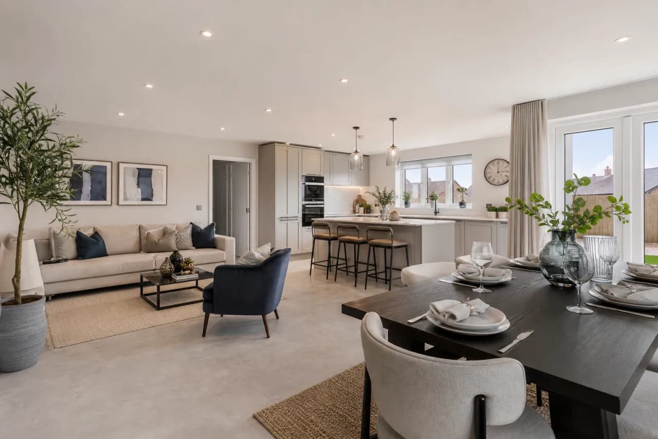 Virtually staged open-plan house with furnished living, dining and kitchen areas